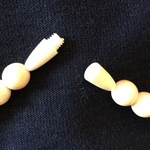 Necklace carved toggle with carved doll